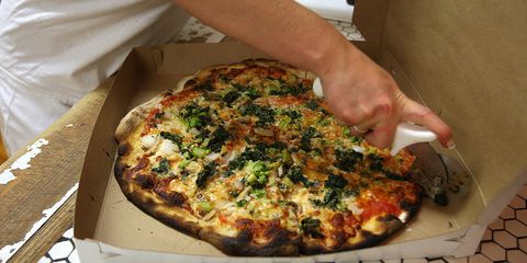 EEN pizza is prepared for a take out customer at Frank Pepe Pizzeria on Wooster Street in New Haven's Little Italy.
