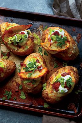 Disse just might be the world's best and most indulgent baked potatoes. First they're stuffed with sour cream and Parmigiano-Reggiano, then they're topped with tangy gravy, melted mozzarella, bits of crisp bacon and, finally, fried potato skins.Recipe: Poutine-Style Twice-Baked Potatoes